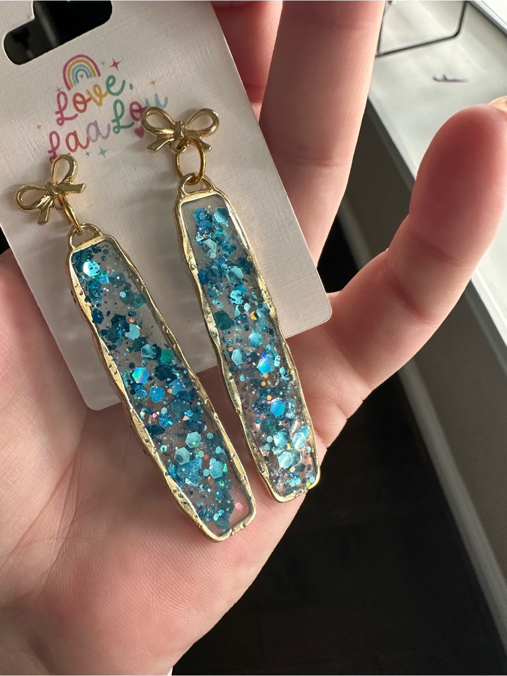 Gold Bow Drop Earrings with Blue Glitter Inlay